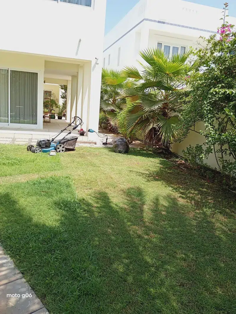 Bare plot elevation grading and laser leveling survey for new garden construction in Muscat villa